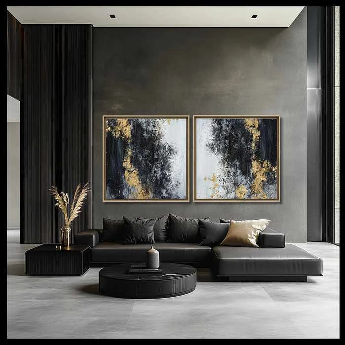 Two gold and beige abstract art pieces complement luxurious armchairs in a sophisticated modern living room setting. Harmonious blend of textures and colors.