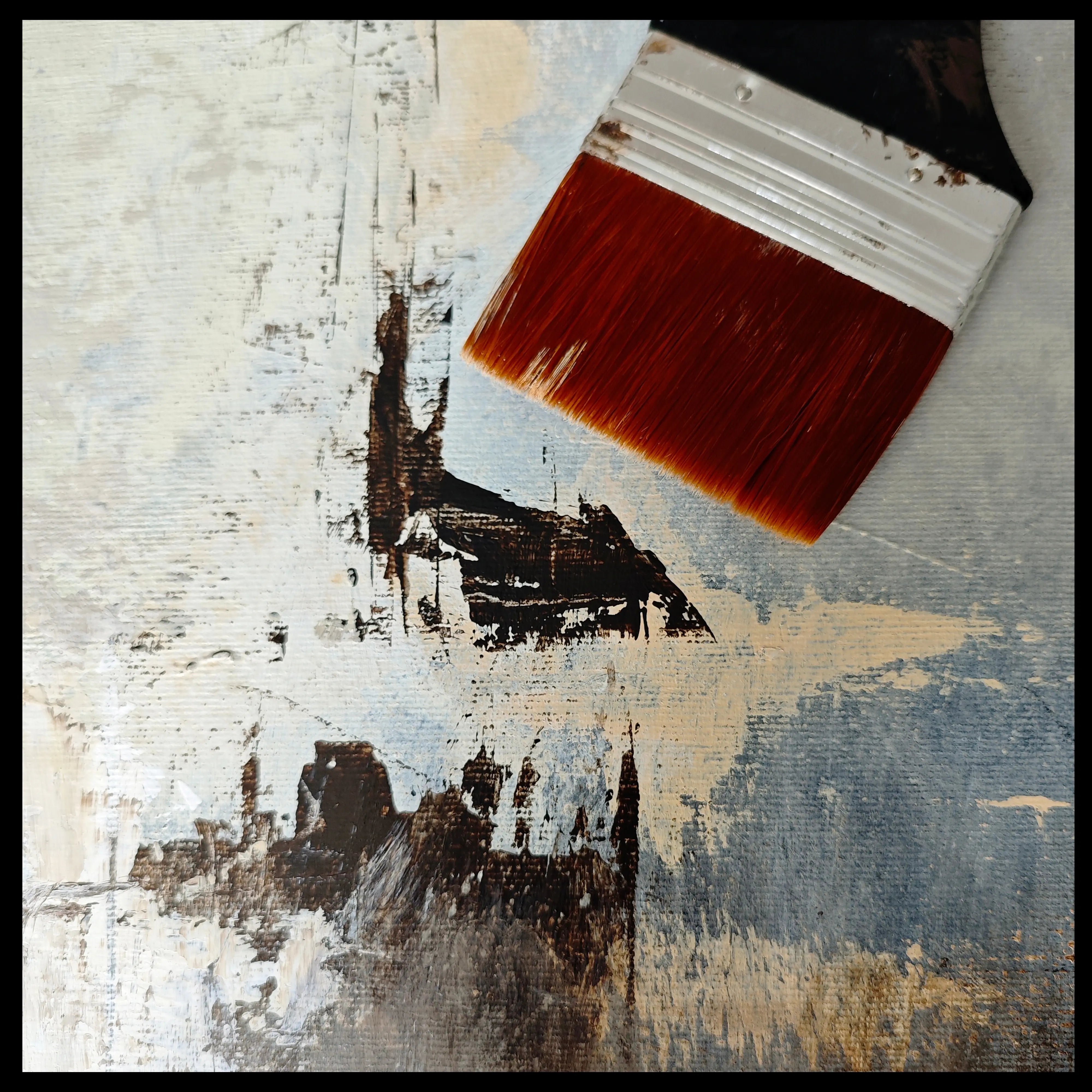 Close up on a canvas and artist brush laying on the painting in the artist studio of Anez Ka abstract artist. 